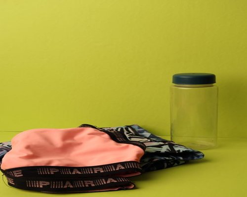 Minimalist arrangement of daily hydration objects and fresh water container