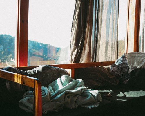 A comfortable quiet room corner prepared for physical relaxation and deep restorative rest